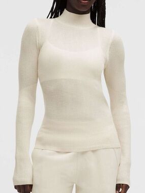 NWT Lululemon Ribbed Merino-Blend Turtleneck Sweater
Light Ivory Size XL